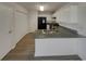 The kitchen features modern appliances, white cabinets, and a stylish breakfast bar at 207 Autumn Lake Way, Mcdonough, GA 30253