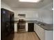 Well-equipped kitchen featuring updated appliances, white cabinetry, and ample counter space at 207 Autumn Lake Way, Mcdonough, GA 30253