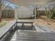 Covered patio features built-in benches and an open design with backyard views at 207 Autumn Lake Way, Mcdonough, GA 30253