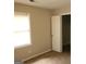 Bedroom featuring a window and a doorway leading to closet space at 2627 Evans Mill Dr, Lithonia, GA 30058