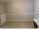 Dining area featuring tile floor, neutral wall color, and decorative trim, creating a warm, inviting dining space at 2627 Evans Mill Dr, Lithonia, GA 30058