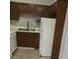 Cozy kitchen with dark cabinets and white appliances at 2627 Evans Mill Dr, Lithonia, GA 30058