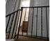Landing area with black metal railing and a view of the bathroom at 2627 Evans Mill Dr, Lithonia, GA 30058