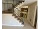 View of the staircase with metal railing leading to the kitchen at 2627 Evans Mill Dr, Lithonia, GA 30058