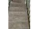 Carpeted staircase with metal railings leading upwards at 2627 Evans Mill Dr, Lithonia, GA 30058