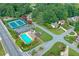 Aerial view of the community's amenities, including tennis courts, a swimming pool, and manicured green spaces at 4314 Deep Springs Nw Ct, Kennesaw, GA 30144