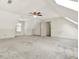 Finished attic space with neutral carpet, skylight and ceiling fan at 4314 Deep Springs Nw Ct, Kennesaw, GA 30144