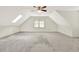 Finished attic space with skylight, window and neutral carpet at 4314 Deep Springs Nw Ct, Kennesaw, GA 30144