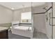 Bathroom features a separate shower and soaking tub, with grey tile and modern fixtures at 4314 Deep Springs Nw Ct, Kennesaw, GA 30144