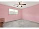 Bedroom with carpet, light and ceiling fan with overhead lighting and a window at 4314 Deep Springs Nw Ct, Kennesaw, GA 30144