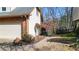 Long brick driveway leads to an attached garage, bordered by well-maintained landscaping at 4314 Deep Springs Nw Ct, Kennesaw, GA 30144