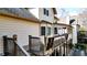 Rear exterior showing the wooden deck, exterior paint colors, and access to the backyard at 4314 Deep Springs Nw Ct, Kennesaw, GA 30144