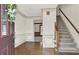 Entryway featuring hardwood floors, staircase, neutral walls, and decorative trim at 4314 Deep Springs Nw Ct, Kennesaw, GA 30144