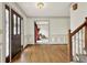 View of the foyer with hardwood floors, staircase, and decorative trim, leading to other rooms at 4314 Deep Springs Nw Ct, Kennesaw, GA 30144