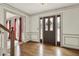 Foyer with hardwood flooring, decorative trim, and a multi-paneled front door, leading to other rooms at 4314 Deep Springs Nw Ct, Kennesaw, GA 30144