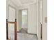 Bright hallway with neutral paint, carpeted floor and wood banister at 4314 Deep Springs Nw Ct, Kennesaw, GA 30144