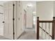 Hallway with neutral walls, carpeted floors, and a view to additional rooms at 4314 Deep Springs Nw Ct, Kennesaw, GA 30144