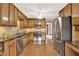 Kitchen with stainless steel appliances, granite countertops, hardwood floors and view into the dining room at 4314 Deep Springs Nw Ct, Kennesaw, GA 30144
