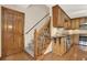 Kitchen with wood cabinets, granite countertops, stainless steel appliances and stairs leading to second floor at 4314 Deep Springs Nw Ct, Kennesaw, GA 30144