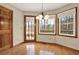 Eat-in kitchen dining nook with hardwood floors, door to the outside and wooded views at 4314 Deep Springs Nw Ct, Kennesaw, GA 30144