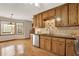 Well lit kitchen features wood cabinets, granite counters, hardwood floors and stainless steel appliances at 4314 Deep Springs Nw Ct, Kennesaw, GA 30144