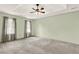 Spacious main bedroom featuring a ceiling fan and two large windows at 4314 Deep Springs Nw Ct, Kennesaw, GA 30144