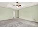 View of the main bedroom, featuring a ceiling fan and connecting doors at 4314 Deep Springs Nw Ct, Kennesaw, GA 30144