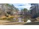Scenic view of a pond reflecting the trees and sky, creating a peaceful and natural setting at 4314 Deep Springs Nw Ct, Kennesaw, GA 30144
