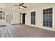 Sunroom features weathered wood flooring, neutral walls, and large windows and doors at 4314 Deep Springs Nw Ct, Kennesaw, GA 30144