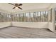 Enclosed sunroom with weathered wood flooring and multiple windows at 4314 Deep Springs Nw Ct, Kennesaw, GA 30144