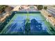 Overhead view of well-maintained blue tennis courts, providing a great recreational space at 4314 Deep Springs Nw Ct, Kennesaw, GA 30144