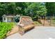 Backyard featuring a stone bench, a playhouse with slide, and garden with stairs leading to patio at 4010 Tamarack Nw Dr, Kennesaw, GA 30152