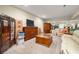 Finished basement featuring neutral carpet, a large TV, and sitting area with mirrored wall at 4010 Tamarack Nw Dr, Kennesaw, GA 30152