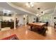 Finished basement with a pool table, bar area, and hardwood floors at 4010 Tamarack Nw Dr, Kennesaw, GA 30152