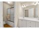 Bright bathroom with a shower, sliding glass doors, and a double vanity at 4010 Tamarack Nw Dr, Kennesaw, GA 30152