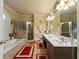 Elegant bathroom with a soaking tub, a shower and and sinks at 4010 Tamarack Nw Dr, Kennesaw, GA 30152