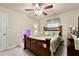 A cozy bedroom with a window, bed, and an adjacent secret door to a playroom at 4010 Tamarack Nw Dr, Kennesaw, GA 30152