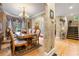 Formal dining area featuring a chandelier and access to a staircase and front entry at 4010 Tamarack Nw Dr, Kennesaw, GA 30152