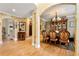 Open dining area with hardwood floors, chandelier, and archways leading to other rooms at 4010 Tamarack Nw Dr, Kennesaw, GA 30152