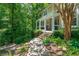 Exterior view of home with a welcoming porch and professionally landscaped front yard at 4010 Tamarack Nw Dr, Kennesaw, GA 30152