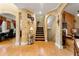 Hallway with hardwood floors, archways, and a staircase leading to the upper level at 4010 Tamarack Nw Dr, Kennesaw, GA 30152
