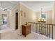 Hallway with carpet, chandelier, and stairway overlook at 4010 Tamarack Nw Dr, Kennesaw, GA 30152