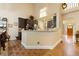 Spacious kitchen with dark cabinets, stainless steel appliances and brick floors at 4010 Tamarack Nw Dr, Kennesaw, GA 30152