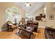 Bright living room with vaulted ceilings, hardwood floors and a view into the kitchen at 4010 Tamarack Nw Dr, Kennesaw, GA 30152