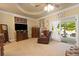 Spacious main bedroom with neutral carpet, seating and access to the backyard at 4010 Tamarack Nw Dr, Kennesaw, GA 30152
