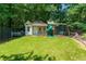 Backyard featuring a playhouse, a slide, and swings, perfect for entertainment at 4010 Tamarack Nw Dr, Kennesaw, GA 30152