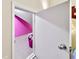 A secret playroom with pink walls accessible through a hidden door in the bedroom at 4010 Tamarack Nw Dr, Kennesaw, GA 30152