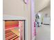 Hidden playroom with secret bookcase entrance and pink striped carpeting at 4010 Tamarack Nw Dr, Kennesaw, GA 30152