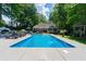 Sparkling pool surrounded by lounge chairs and lush greenery, perfect for relaxation and outdoor enjoyment at 4010 Tamarack Nw Dr, Kennesaw, GA 30152