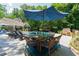 Poolside patio with dining and lounge areas, ideal for enjoying outdoor meals and relaxation at 4010 Tamarack Nw Dr, Kennesaw, GA 30152